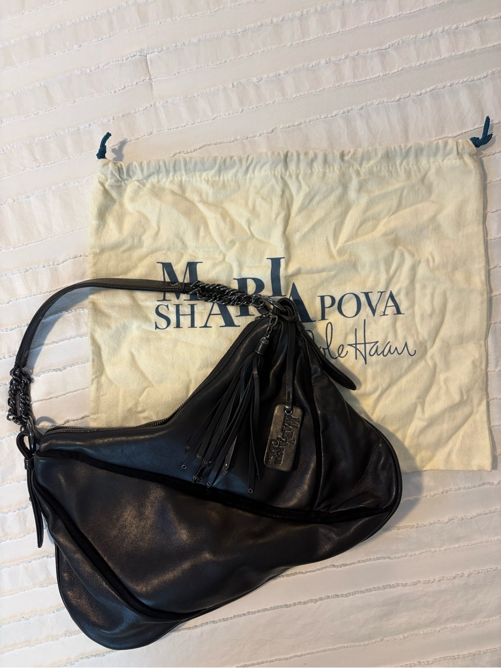 Cole Haan Black Leather Hobo Bag with Tassel and Chain Accent